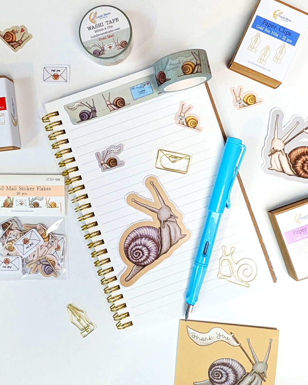 An assortment of new snail mail-themed stationery by Lucid Moon Studio