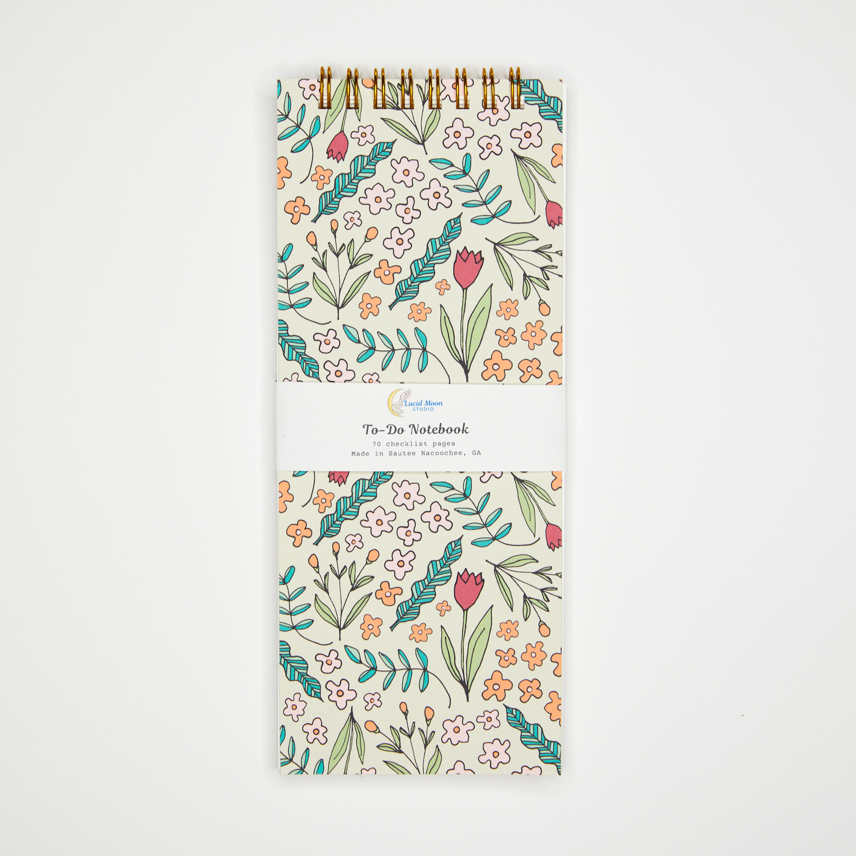 Top spiral checklist notebook with floral illustration on the cover.
