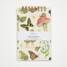 Mini notebook with nature-themed design on a white background