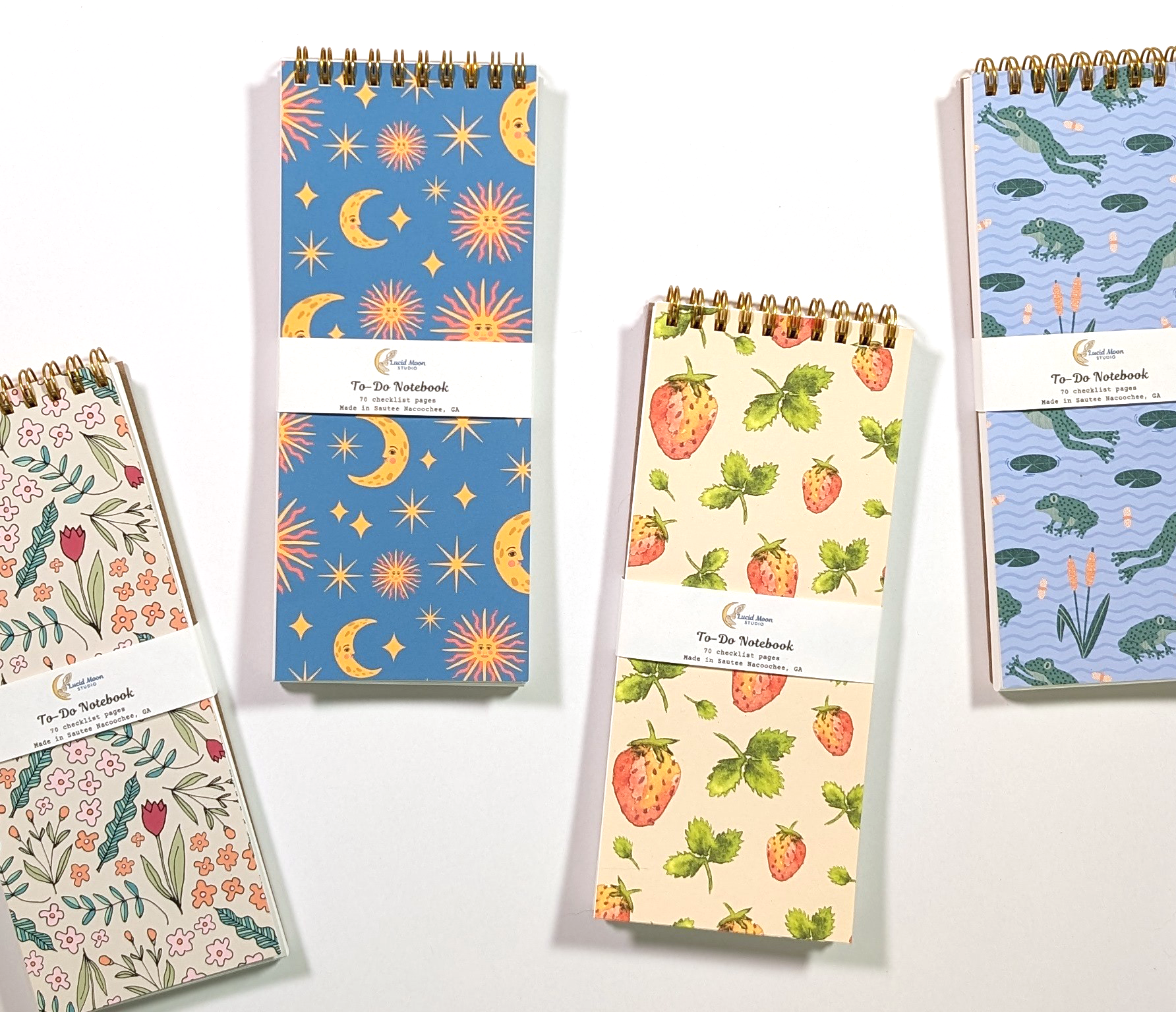 Four top spiral To Do List Notebooks with nature-inspired illustrations on the covers and 70 checklist pages printed on heavy paper.