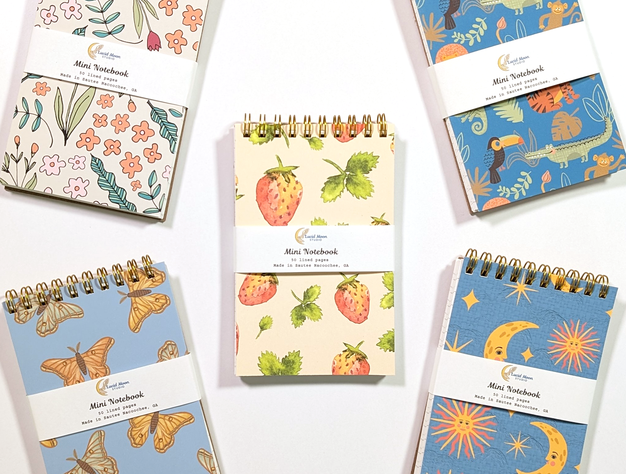 A selection of our top spiral-bound eco-friendly jotter notebooks featuring hand-drawn colorful designs inspired by nature