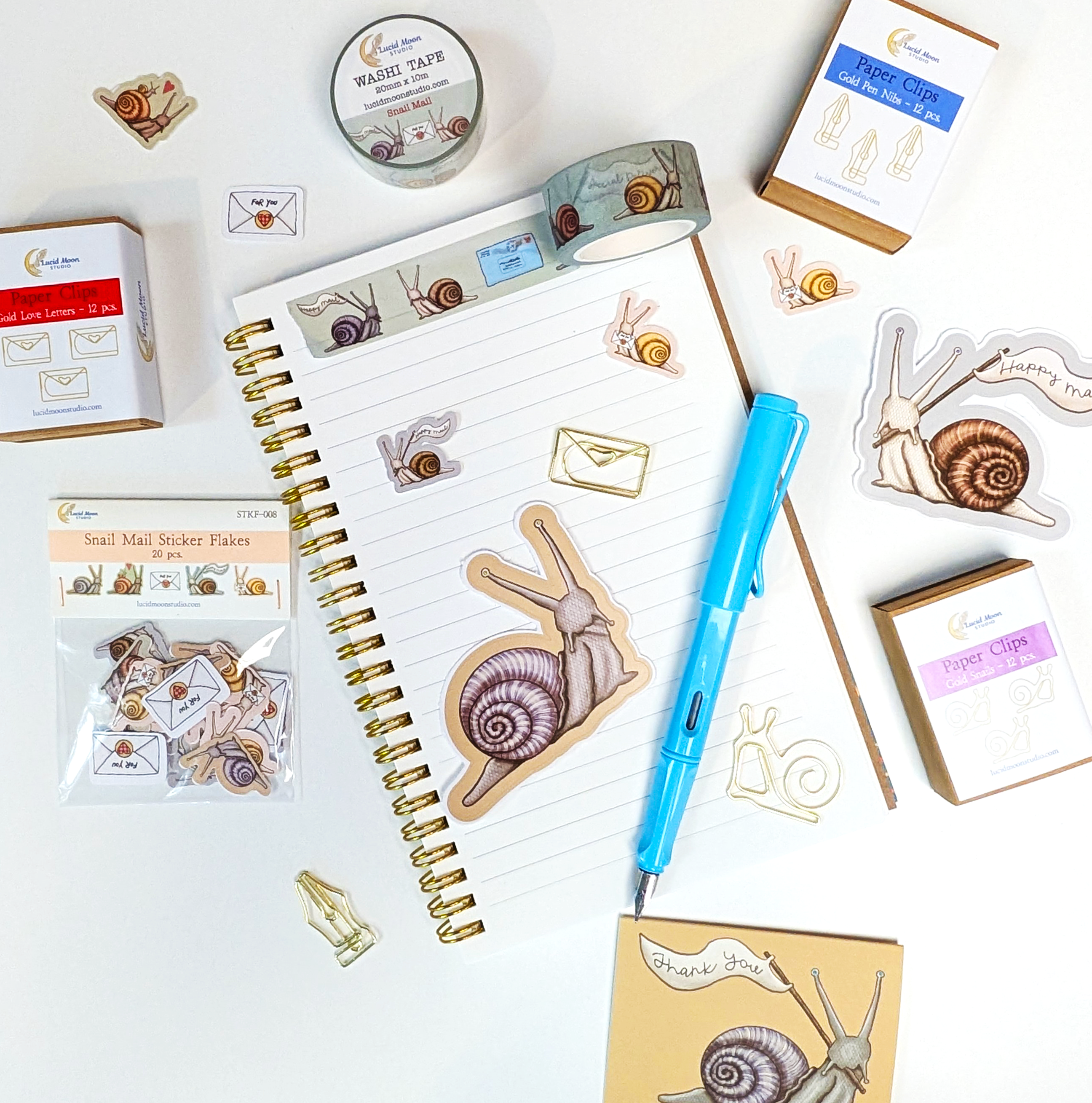 An assortment of new snail mail-themed stationery by Lucid Moon Studio