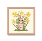 Framed artwork of a rabbit among yellow flowers on a white background