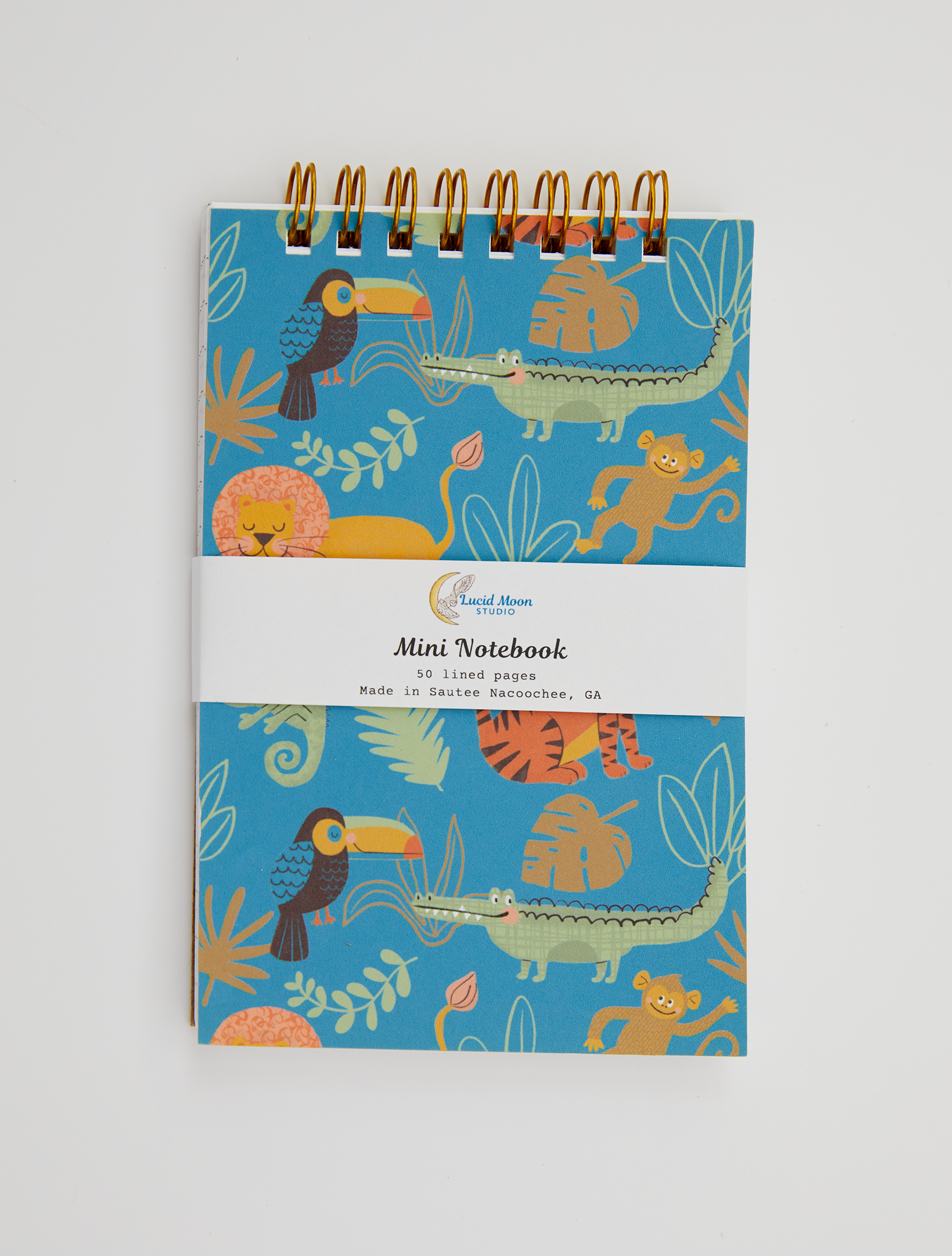 Mini spiral notebook with jungle animal illustrations on a blue background