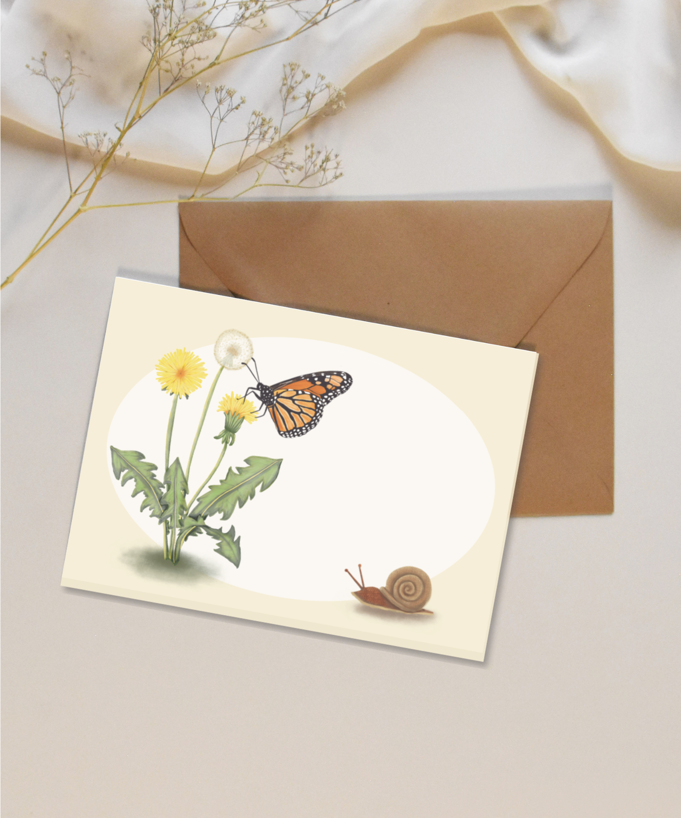 Blank mini card featuring a monarch butterfly and dandelions on a white and tan background with a brown kraft envelope.