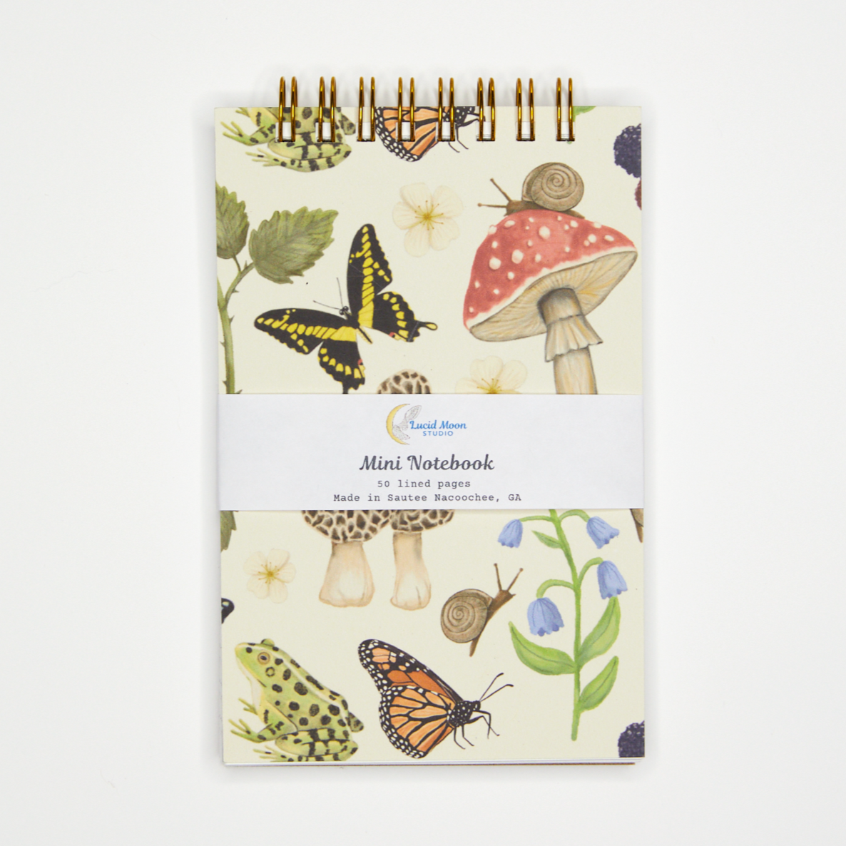 Mini notebook with nature-themed design on a white background