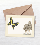 Greeting card with a swallowtail butterfly and morel mushrooms design with a brown kraft envelope.