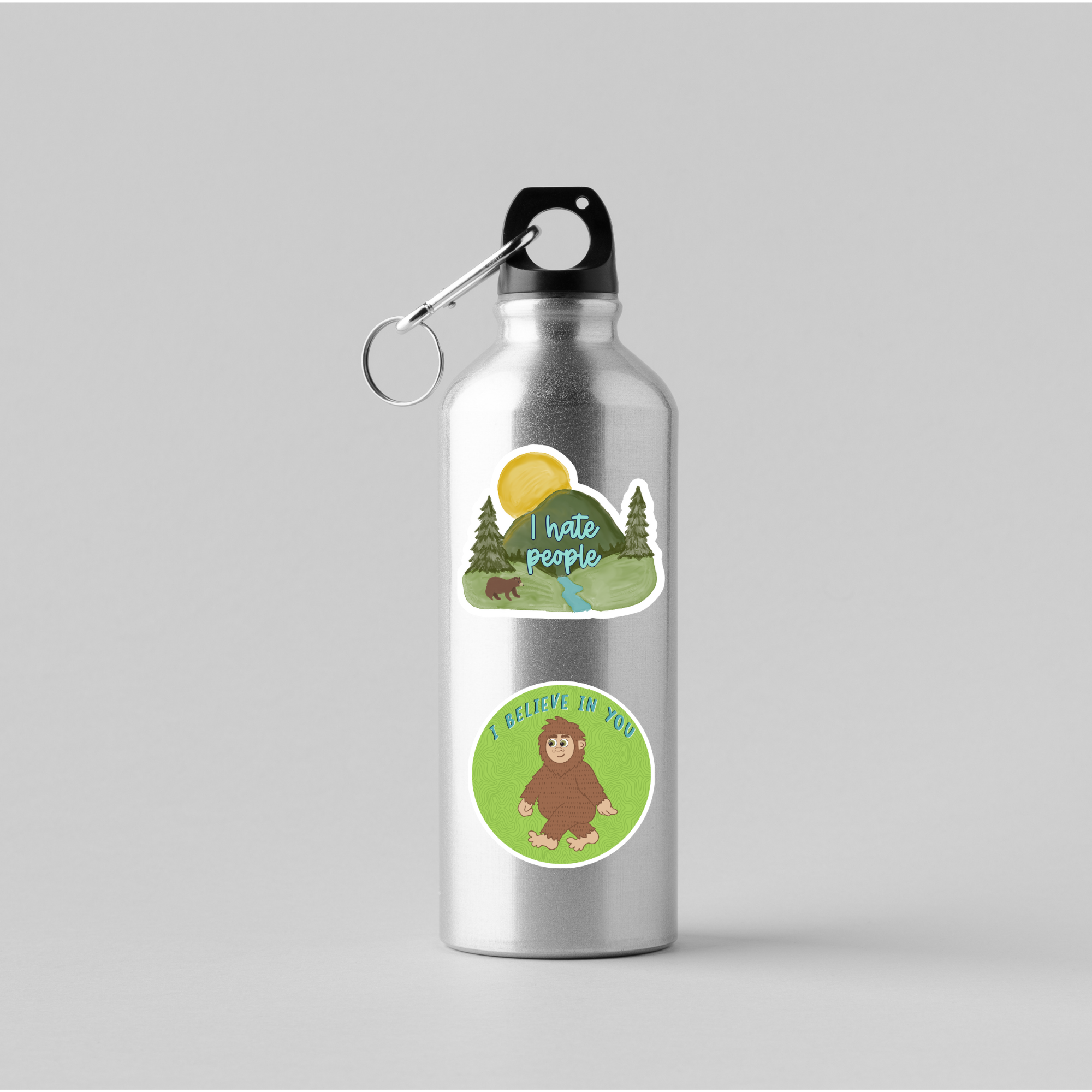 Silver water bottle with Mountain and 
Big Foot vinyl stickers on it.