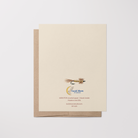 Back of greeting card with a brown and yellow fishing fly illustration, Lucid Moon Studio logo, website, and card information on top of a brown kraft envelope.
