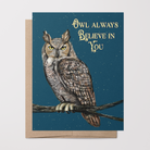 Greeting card with a painted Great Horned owl on a branch illustration on a dark blue background with stars on top of a brown kraft envelope.