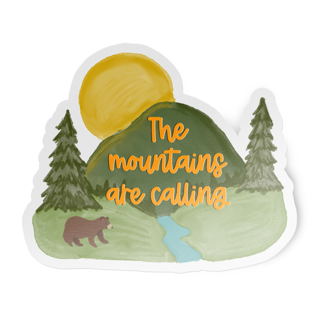 Sticker with mountain landscape, bear, and 'The mountains are calling' text on a white background