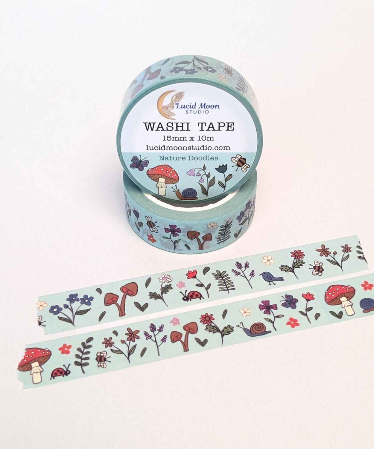 Washi tape with hand-drawn nature doodles on a light turquoise background