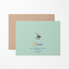 Back of greeting card with an illustration of a blue fishing fly, Lucid Moon Studio logo, website, and card information on a mint green background.