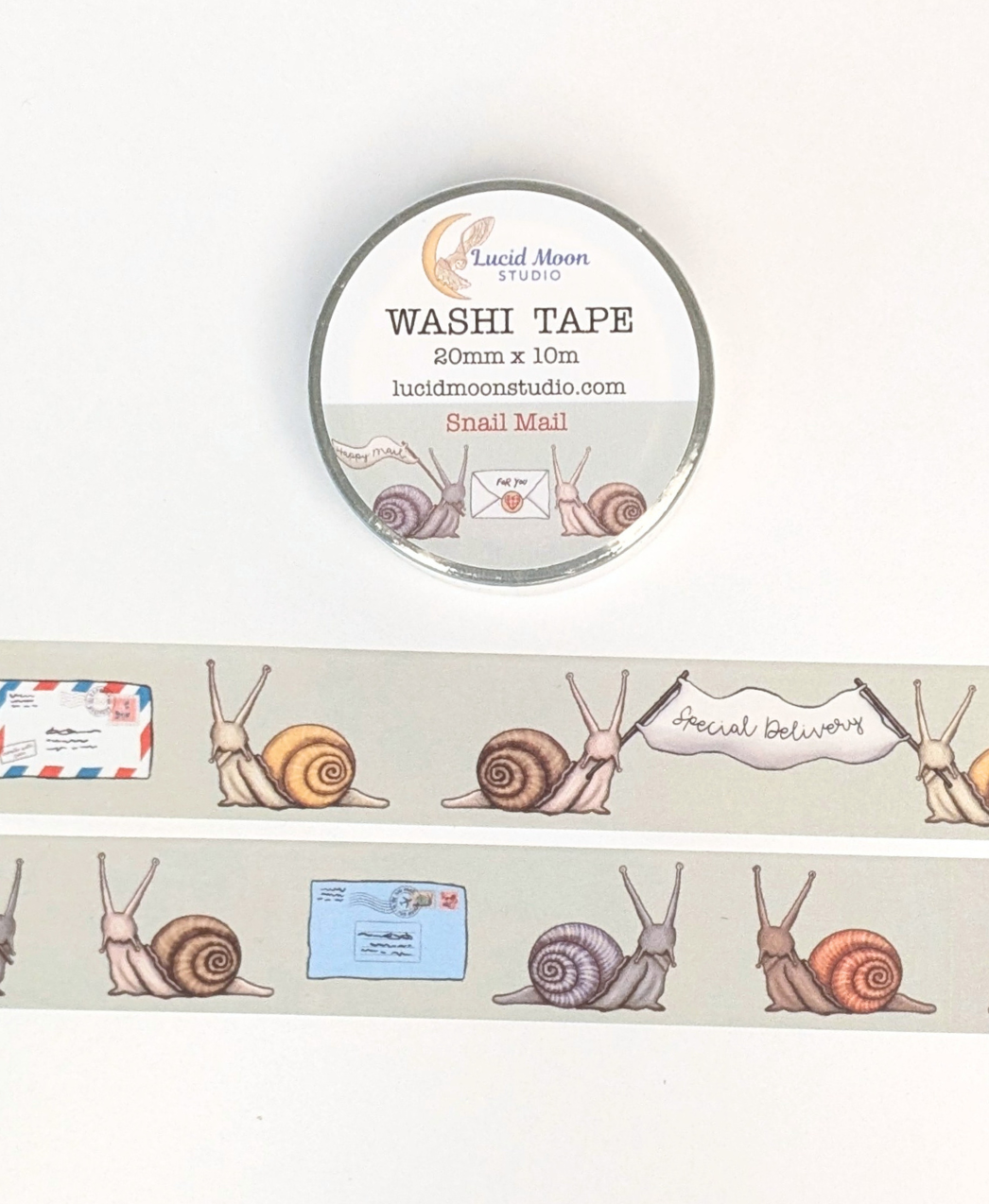 Washi tape with snails and mail themed illustrations on a light green background